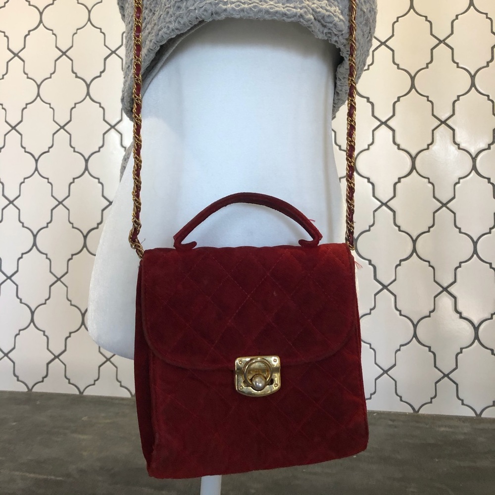 Red suede quilted purse.